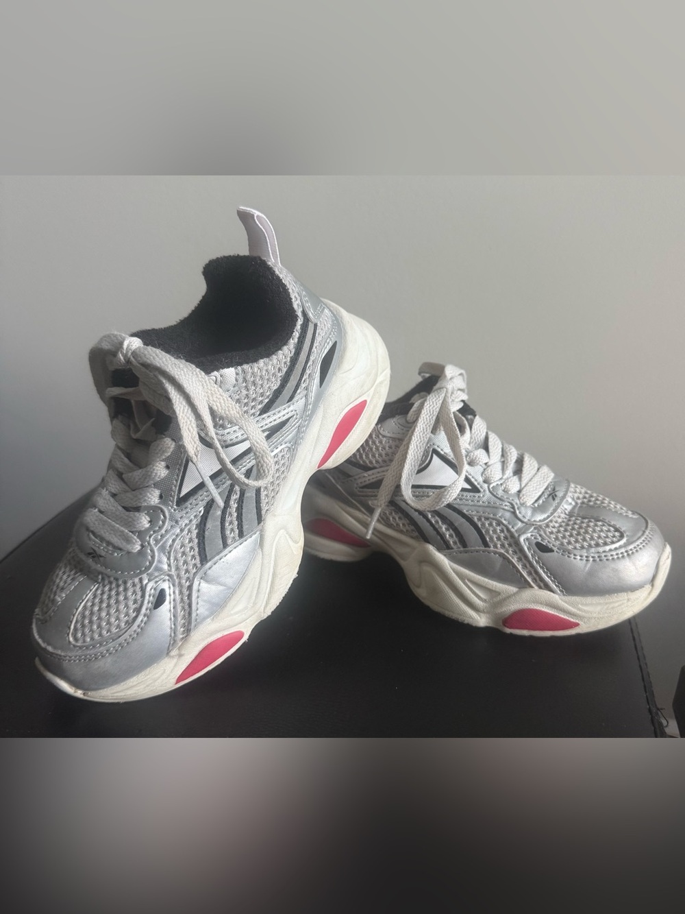 Kids Reebok Silver Athletic Sneakers with black, white, & Pink Accents..